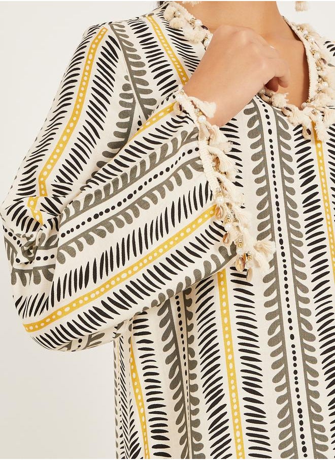 Styli - stripe pattern print A line jalabiya w/ shell tassel trim at neck and sleeve hem - Image 1