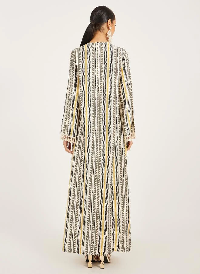 ستايلي stripe pattern print A line jalabiya w/ shell tassel trim at neck and sleeve hem