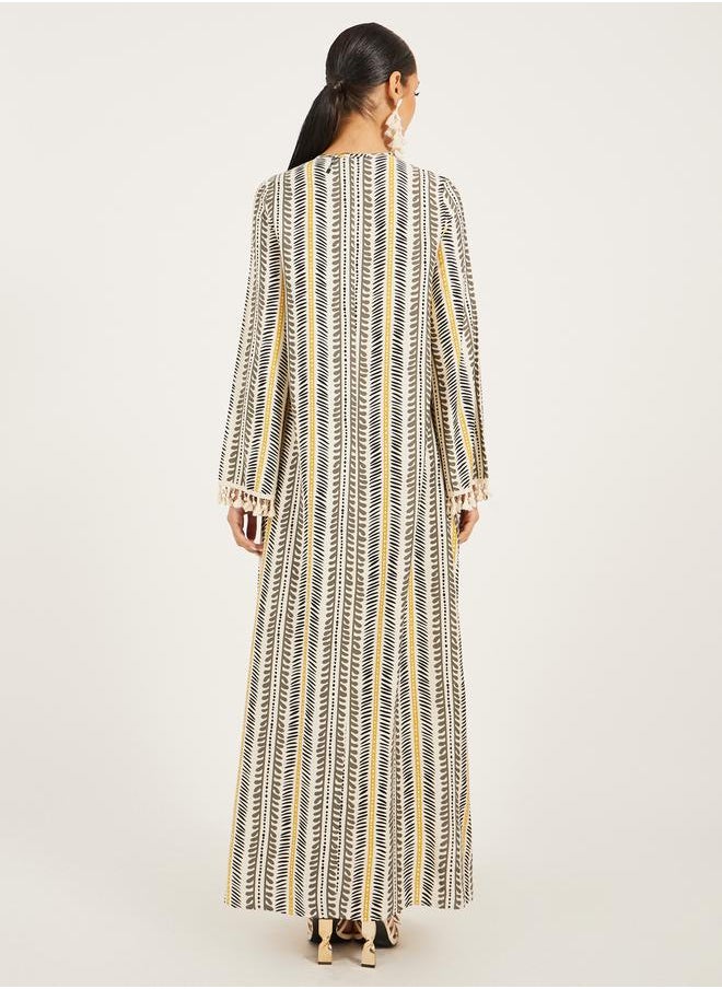 Styli - stripe pattern print A line jalabiya w/ shell tassel trim at neck and sleeve hem - Image 1