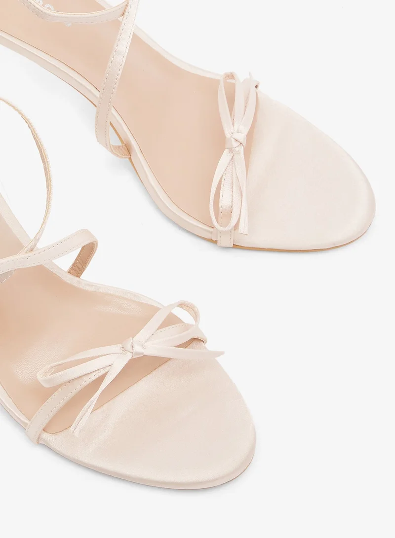 Glamorous BABY PINK Crossed Straps Bow Heel Sandals for Women | Best Price UAE