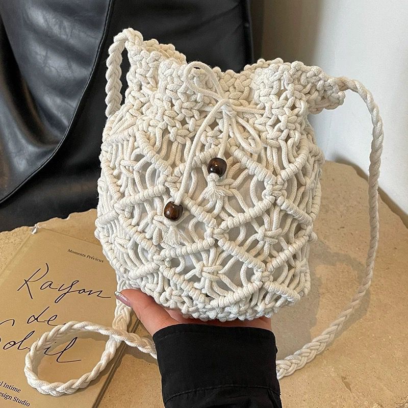 Straw Woven Bag Female Niche Design Summer Woven Crossbody Bucket Bag Fashion Hollow Seaside Beach Bag - Image 1