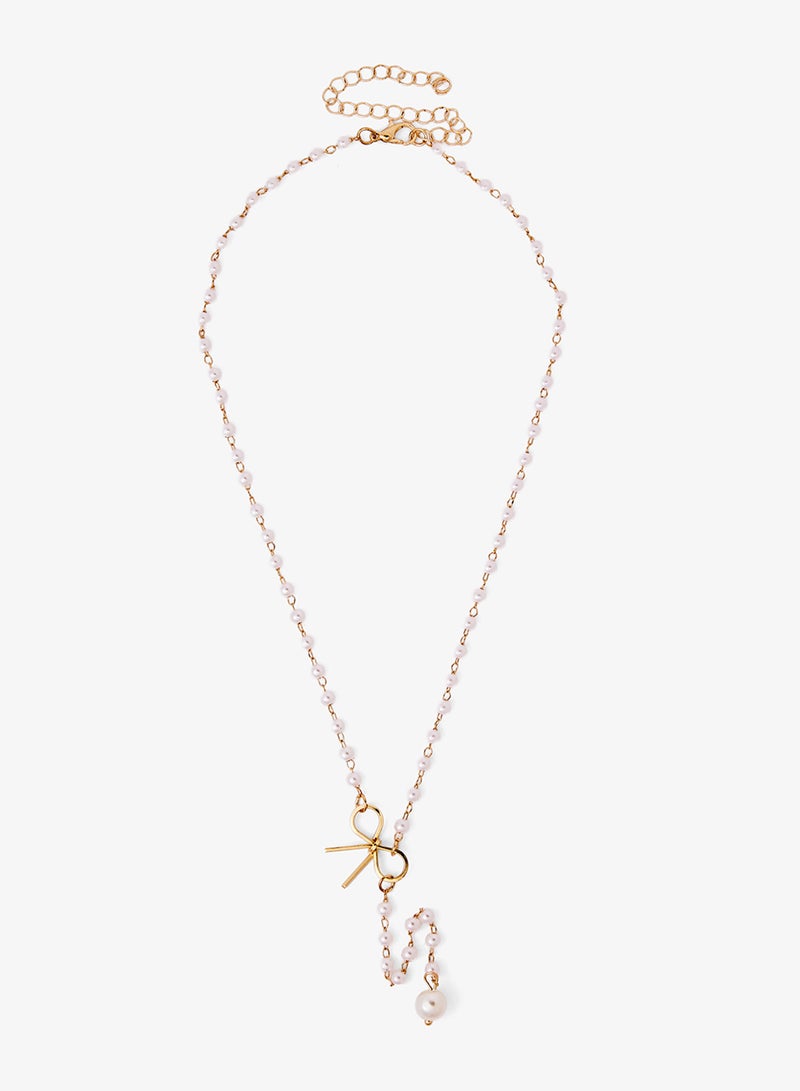 ELLA Pearl Bow Lariat Necklace - Image 1