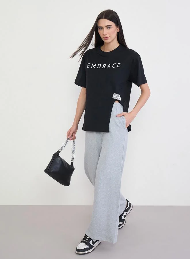 Styli Black 100% Cotton Oversized T-Shirt with Slit and Badge Detail