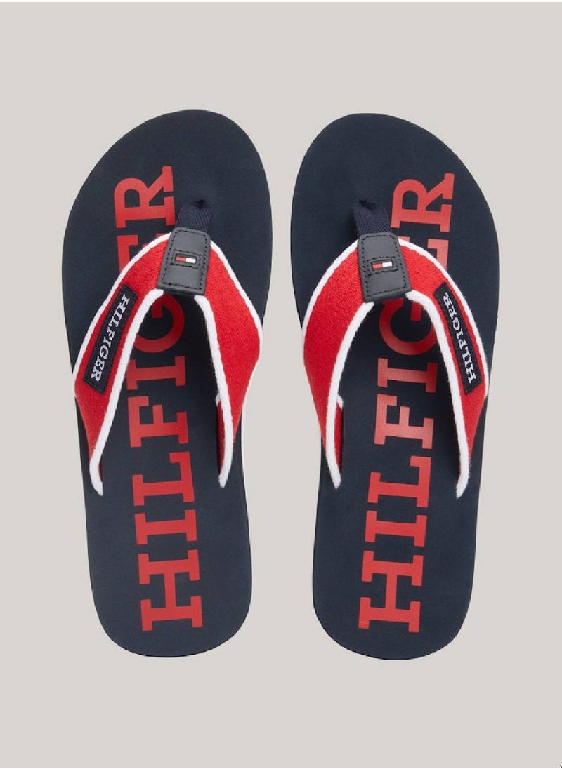 TOMMY HILFIGER - Men's Hilfiger Monotype Webbing Strap Flip-Flops -  Polyester webbing upper, Red - Image 1