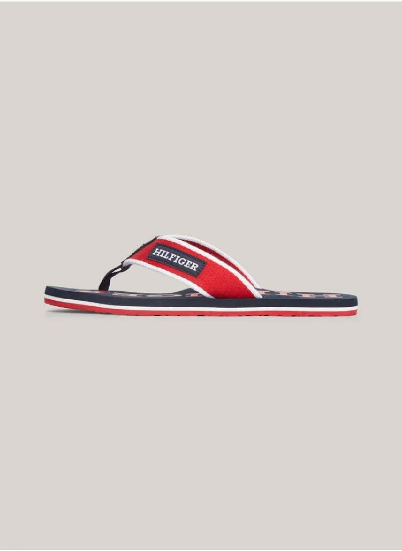 TOMMY HILFIGER Men's Hilfiger Monotype Webbing Strap Flip-Flops -  Polyester webbing upper, Red