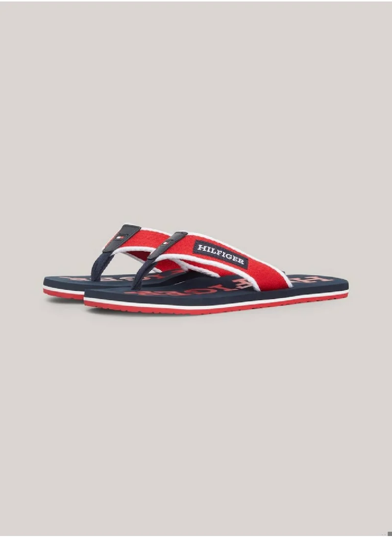 TOMMY HILFIGER Men's Hilfiger Monotype Webbing Strap Flip-Flops -  Polyester webbing upper, Red