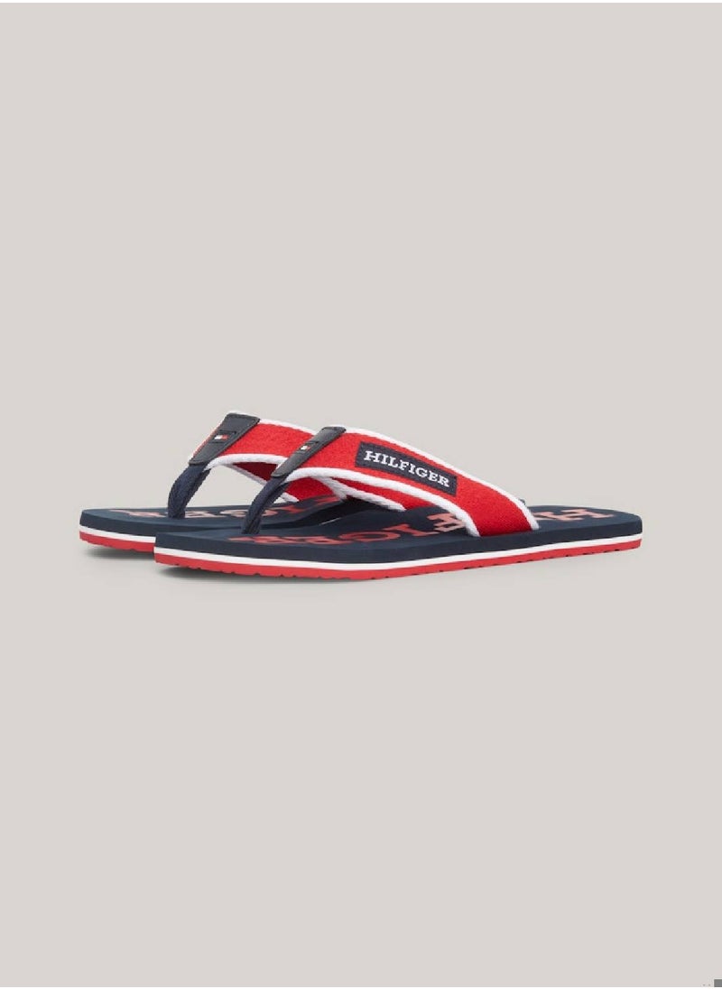 TOMMY HILFIGER - Men's Hilfiger Monotype Webbing Strap Flip-Flops -  Polyester webbing upper, Red - Image 1