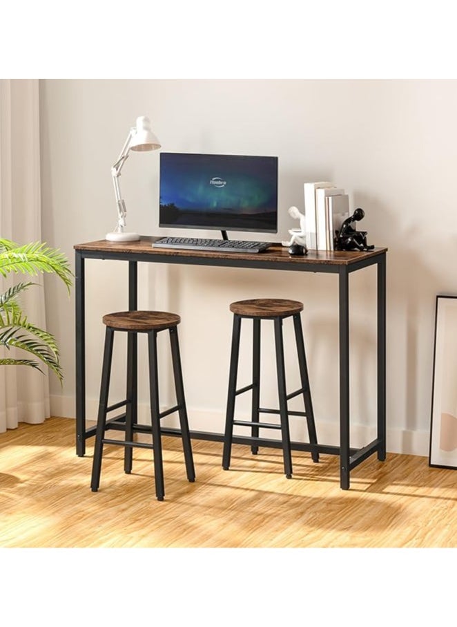 3-piece dining table set, consisting of one high table and two high chairs. It is a high-height kitchen table with seats in a modern and contemporary design and a steel frame. It is placed in the kitchen, dining room, living areas, and social areas. It is a rustic brown color with a black metal frame. It is durable and can be used in the kitchen, living room, dining room, or office. You can use the table as a coffee corner, a work desk, an entrance console, behind the sofa, or as a buffet for appetizers and drinks when needed. The chairs can be used during occasions as additional chairs or as a corner table. In some corners, vases or plant pots can be placed on it. The seat is round and has a soft texture that is not scratched. The chair has comfortable footrests when sitting on it. These details and design touches make you sit more comfortably. Easy to assemble and assemble