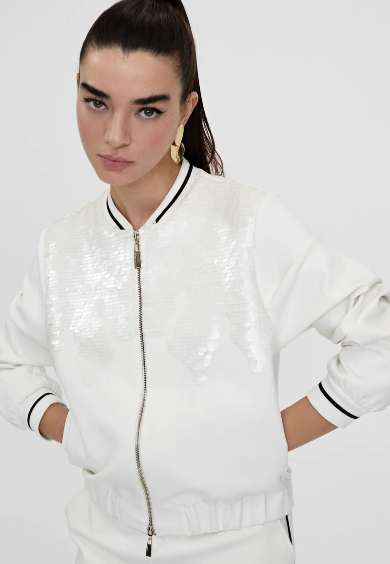 لولا كساديمونت سويت شيرت مزينة بالترتر مزودة بسحاب