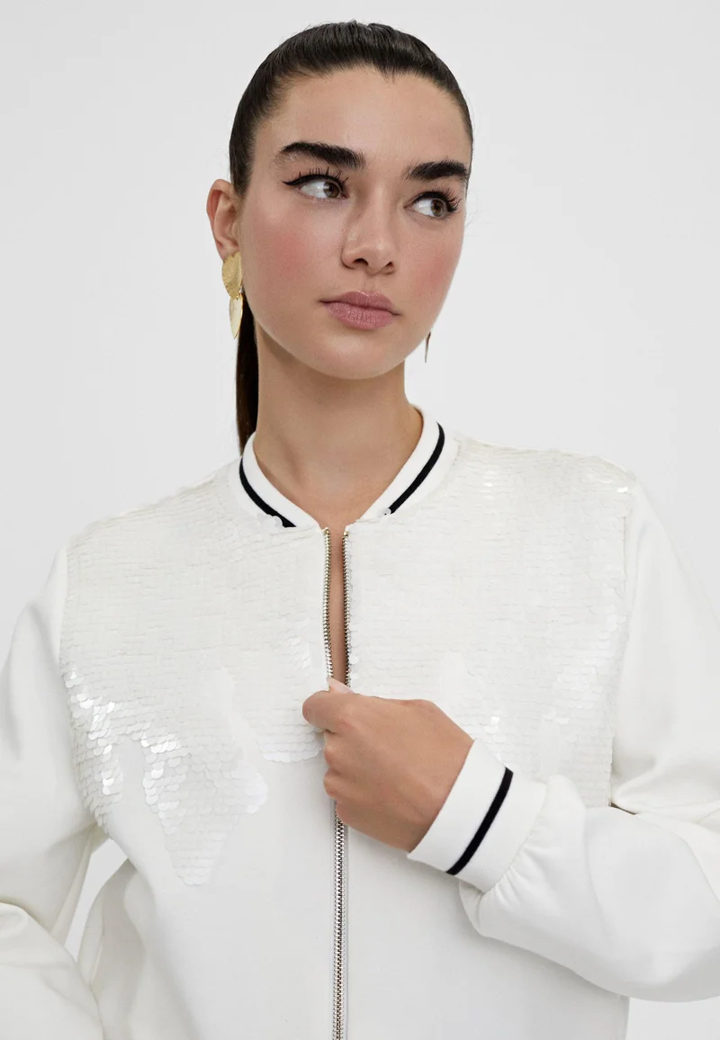 لولا كساديمونت سويت شيرت مزينة بالترتر مزودة بسحاب