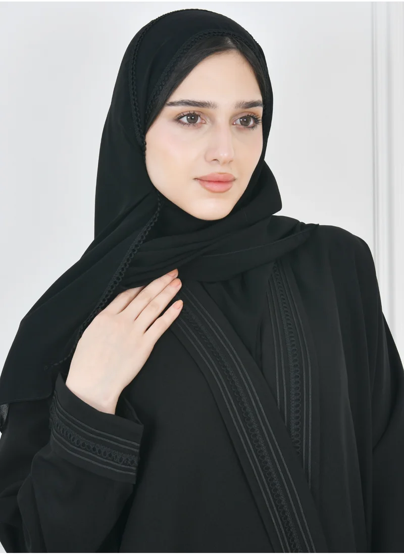 HAWRAA ABAYA Black wrap abaya with a practical design, decorated with veils on the edges of the abaya and sleeves with side pockets