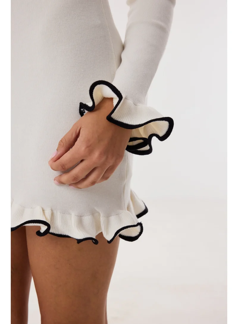 Ashita Fernandes  Knit Body-Skimming Short Dress with Boat Neck & Ruffle Sleeves – Ivory/Black for Women | Best Price UAE
