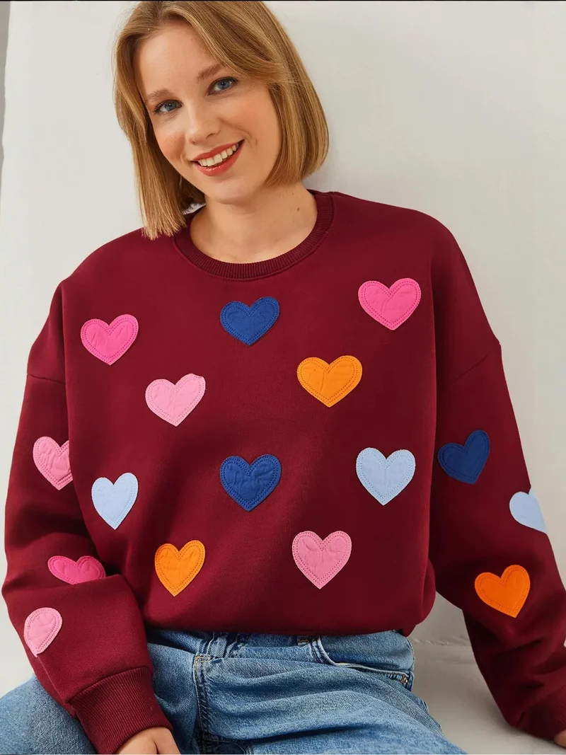 بيانكو لوتشي كنزة قطنية مطرزة بقلوب من لوكسي