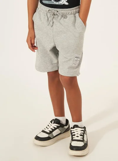 Styli Solid Drawstring Shorts with Badge Detail