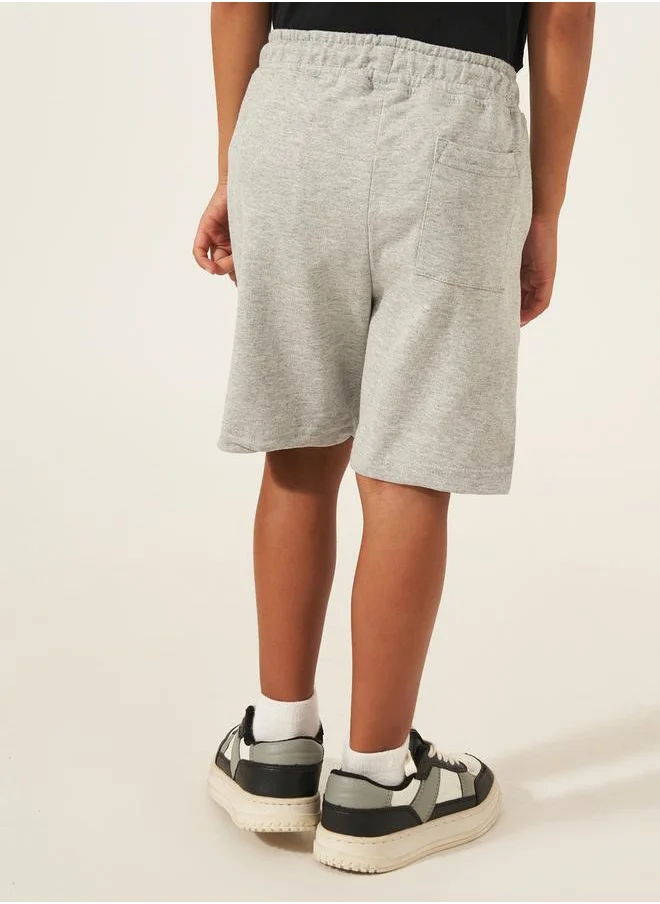 ستايلي Solid Drawstring Shorts with Badge Detail