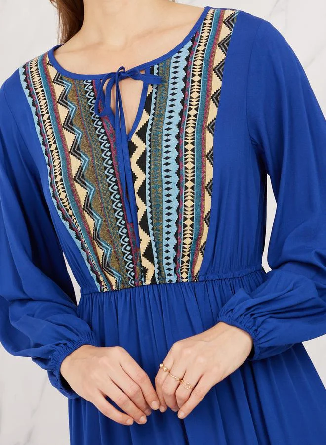 Styli Aztec Printed Tie Up Neck Tiered Maxi Dress
