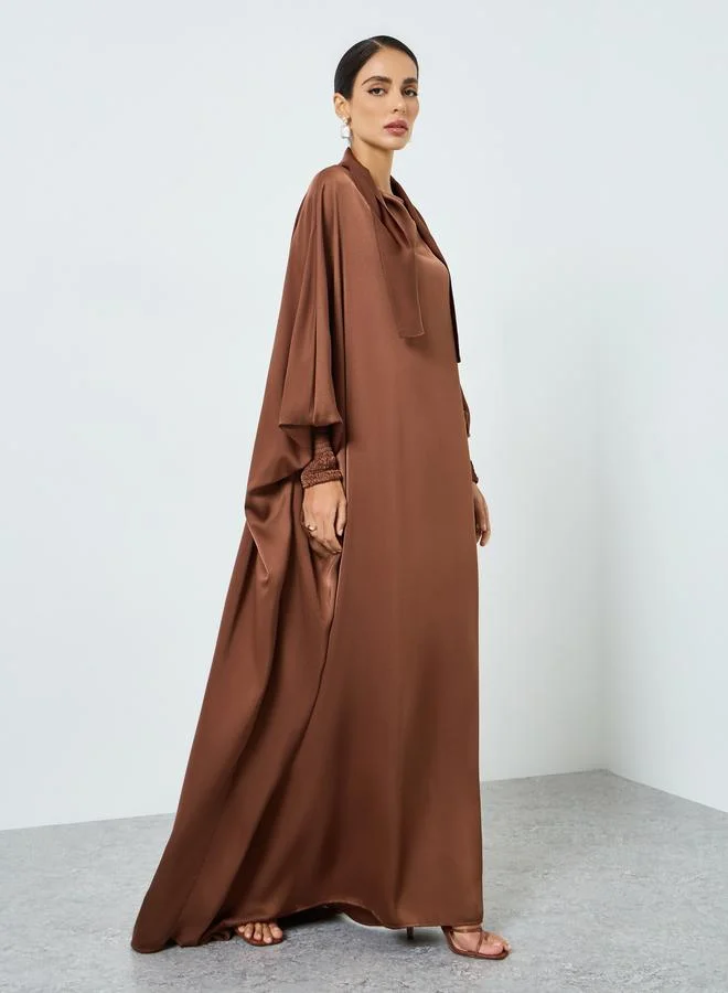 تايك تو جلابية بأكمام خفاش وتصميم واسع من الأسفل