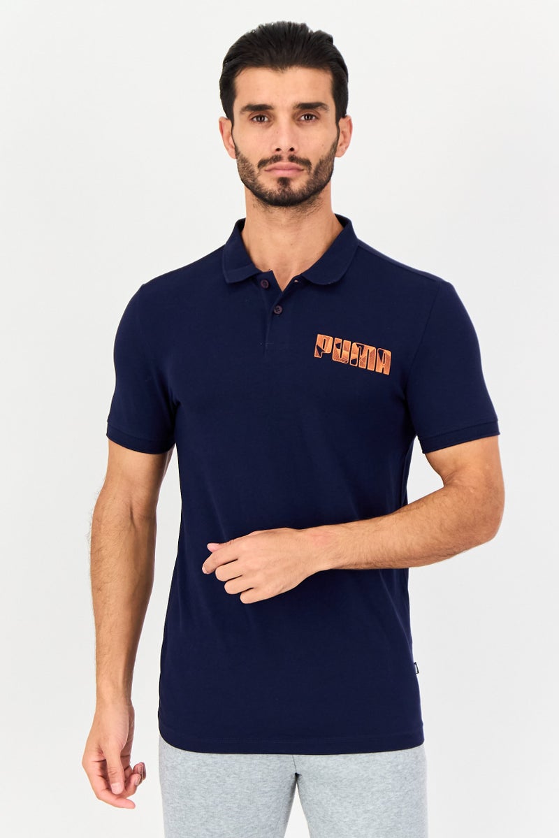 PUMA قميص بولو قصير الأكمام للرجال بتصميم نحيف مع شعار العلامة التجارية، أزرق داكن - Image 1