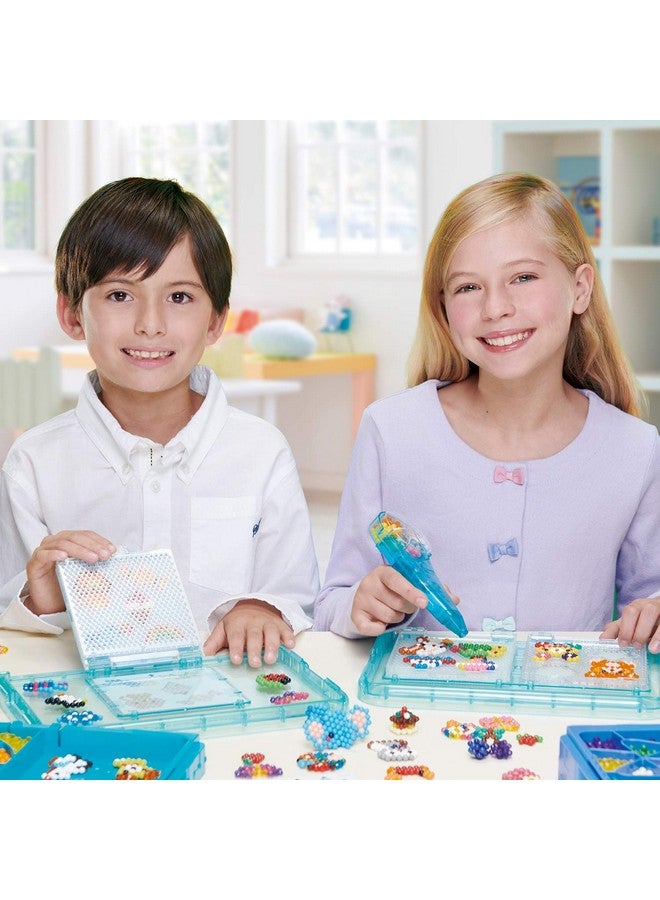 Aquabeads Aquabeads Deluxe Studio - Craft Kit Complete with Over 1300 Solid and Jewel Beads, 2 Flip Trays, Sprayer, Rainbow Bead Pen and Bead Palette Storage Case! - Image 3