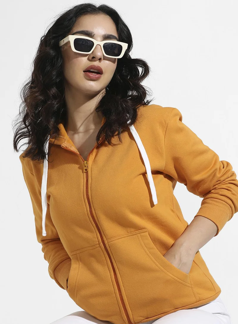 Campus Sutra Women's Mustard Yellow Solid Zip-Front Hoodie For Casual Wear | Hooded Neck | Long Cuffed Sleeves | Zipper Closure | Sweatshirt Crafted With Comfort Fit For Everyday Wear