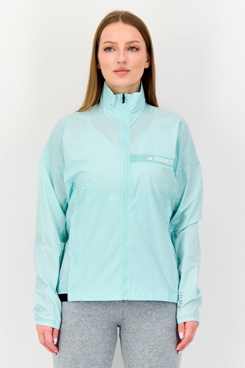 Adidas جاكيت واقي من الرياح بأكمام طويلة للنساء، لون تركواز فاتح - Image 1