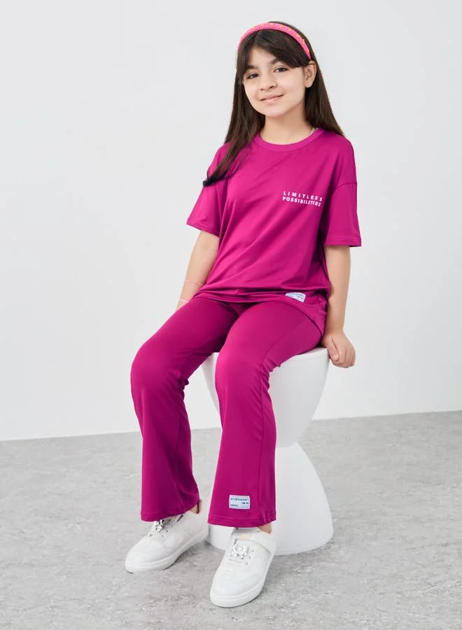 ستايلي Styli Slogan Print Oversized T-Shirt and Flared Leggings Set
