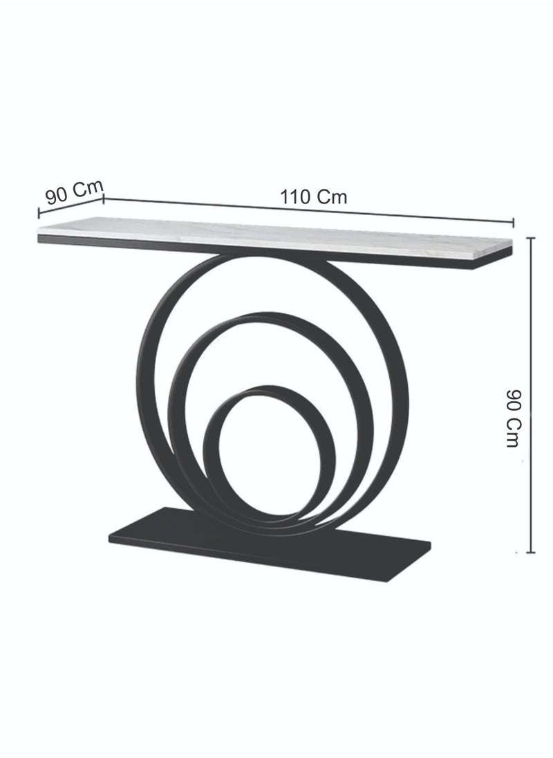 fan baytk - The Modern Gold Entryway Table is a piece of furniture that combines elegance and practicality. With dimensions of 110 cm length x 90 cm height x 30 cm width, this entryway provides ideal storage space for everyday items, and can also be used to display flowers or decorative items, adding a distinctive aesthetic touch to any interior space. Its modern design is in harmony with high-quality materials, making it easy to maintain and ensuring that its attractive appearance is maintained. With a unique visual balance between golden iron and marble wood, this entryway is a great attraction that enhances the aesthetics of your home. - Image 1