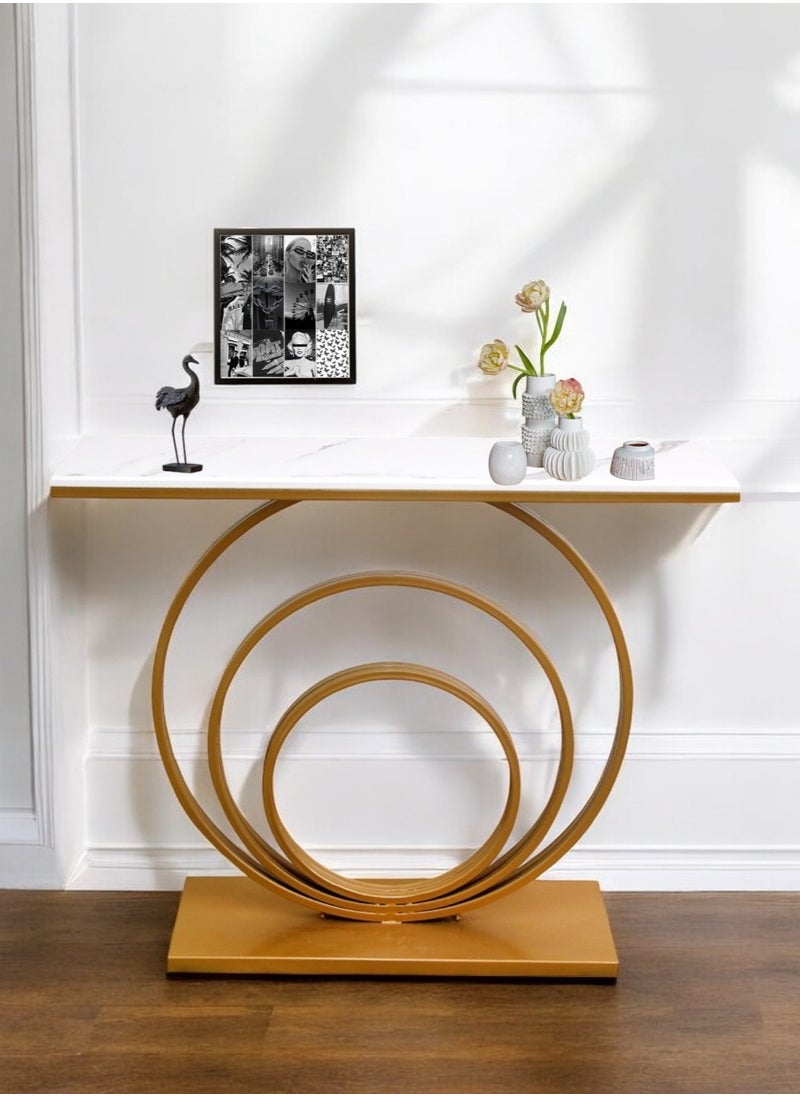 fan baytk - The Modern Gold Entryway Table is a piece of furniture that combines elegance and practicality. With dimensions of 110 cm length x 90 cm height x 30 cm width, this entryway provides ideal storage space for everyday items, and can also be used to display flowers or decorative items, adding a distinctive aesthetic touch to any interior space. Its modern design is in harmony with high-quality materials, making it easy to maintain and ensuring that its attractive appearance is maintained. With a unique visual balance between golden iron and marble wood, this entryway is a great attraction that enhances the aesthetics of your home. - Image 1