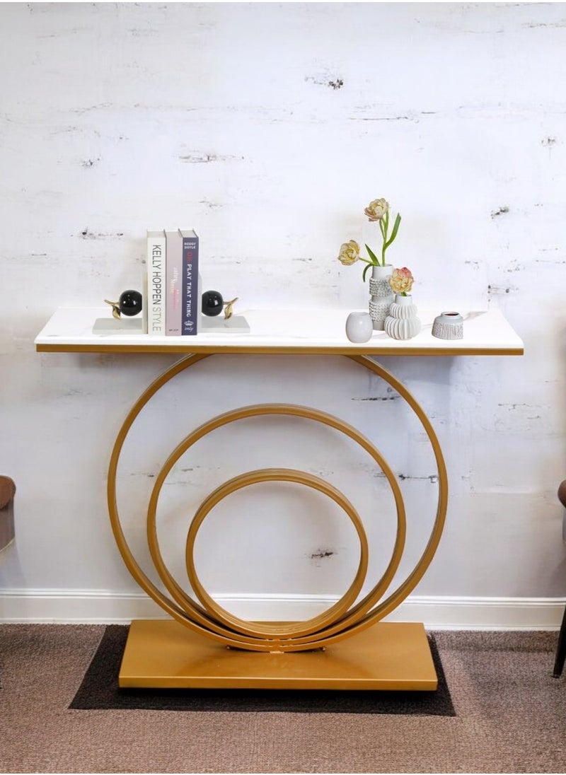 fan baytk - The Modern Gold Entryway Table is a piece of furniture that combines elegance and practicality. With dimensions of 110 cm length x 90 cm height x 30 cm width, this entryway provides ideal storage space for everyday items, and can also be used to display flowers or decorative items, adding a distinctive aesthetic touch to any interior space. Its modern design is in harmony with high-quality materials, making it easy to maintain and ensuring that its attractive appearance is maintained. With a unique visual balance between golden iron and marble wood, this entryway is a great attraction that enhances the aesthetics of your home. - Image 1