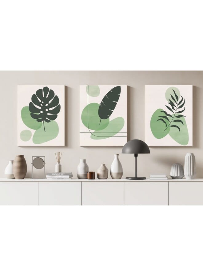 هوم جاليري مجموعة من ثلاث قطع فنية جدارية على شكل أوراق نباتية خضراء ملونة . - Image 1