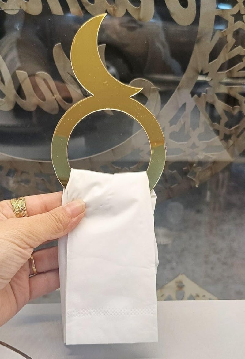 A piece for napkins - a gold, sky-inspired decorative masterpiece that creates a charming atmosphere for your tables at special events and family meals with a luxurious and elegant design.