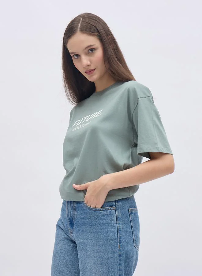 Styli Styli Women Green Slogan Print Short Sleeve Oversized T-Shirt