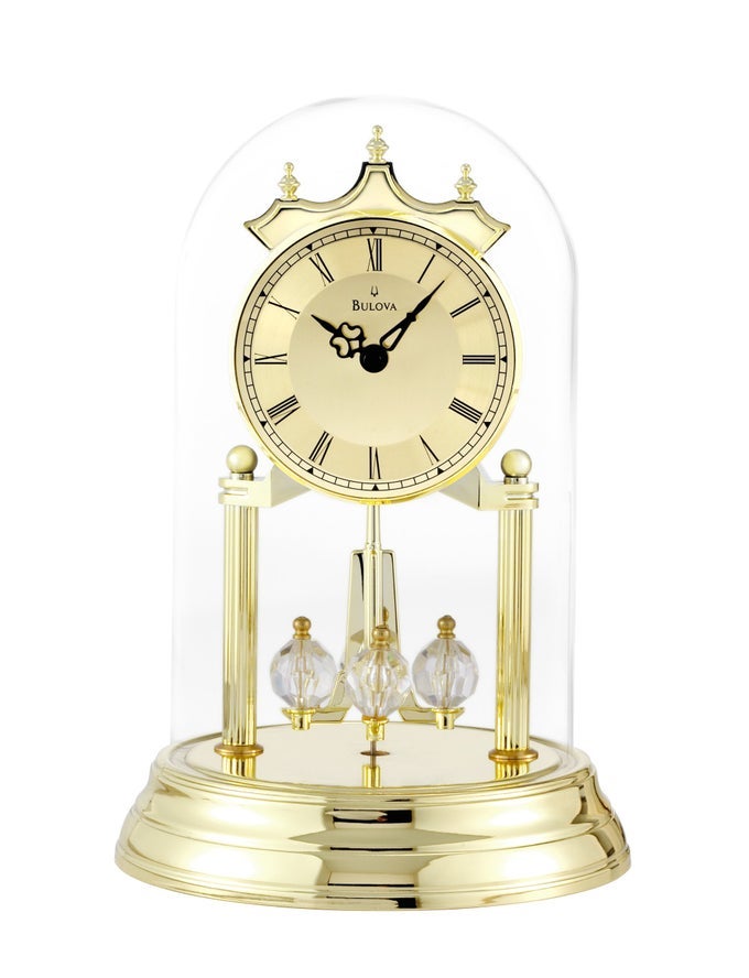 TRISTAN I DESK AND TABLE CLOCK MODEL B8818 POLISHED BRASS FINISH POLISHED METAL BASE FLOATING DIAL ROMAN NUMERALS ELEGANT PENDULUM DESIGN