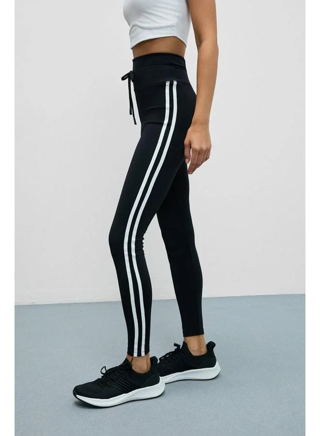 Urban Beat  NORGIA Women's Soft and Stretchy Textured Contrast-Piped Drawstring Black-and-White Leggings. for Women | Best Price UAE