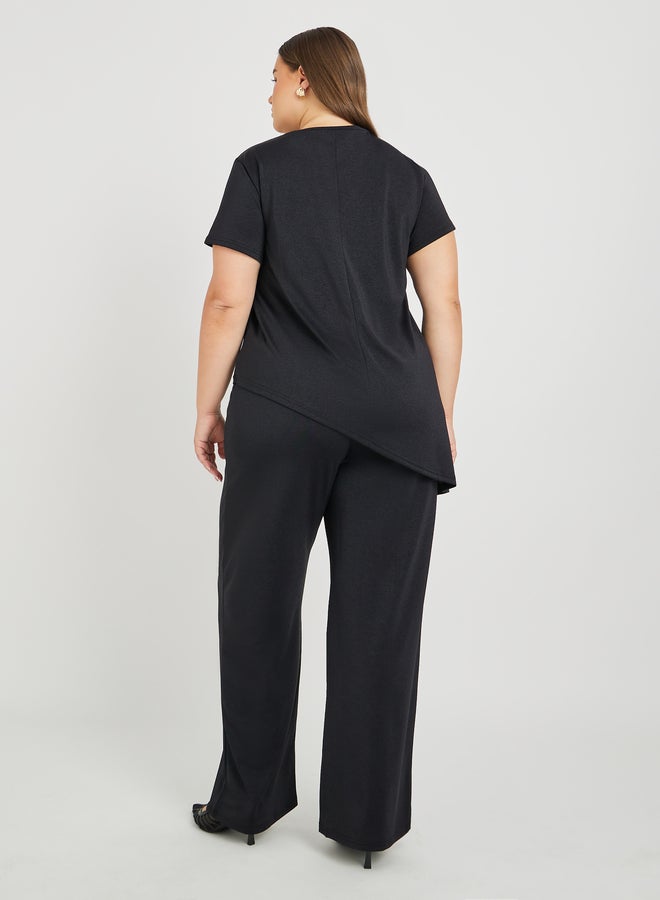 Styli Styli Plus Size Solid Asymmetric Hem T-Shirt and Wide Leg Trousers Co-Ords  - Image 5
