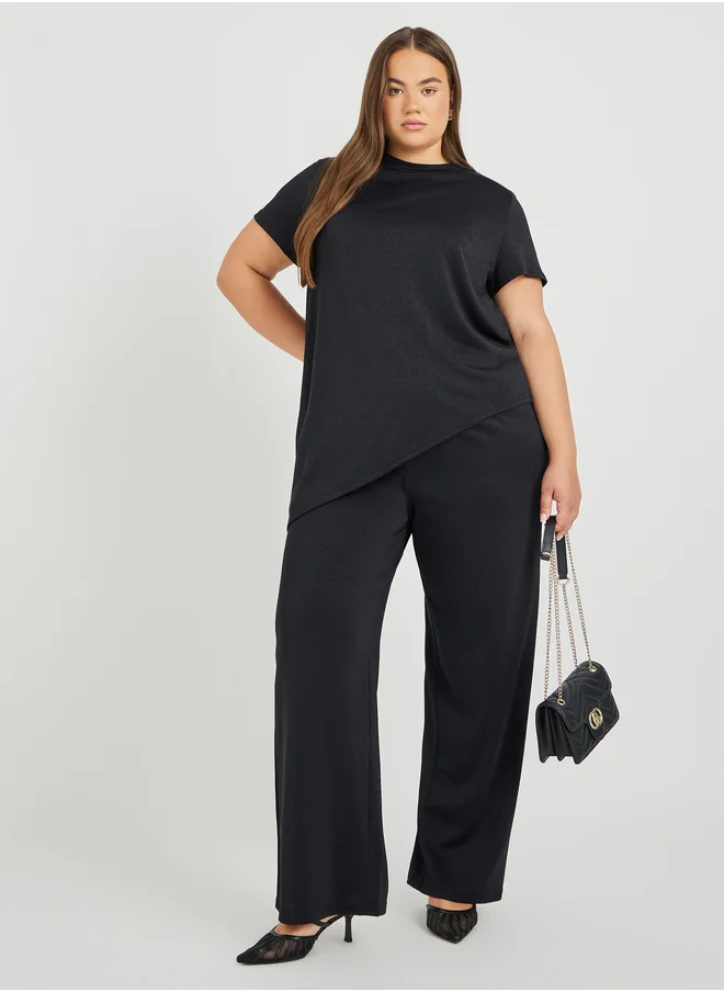 Styli Styli Plus Size Solid Asymmetric Hem T-Shirt and Wide Leg Trousers Co-Ords