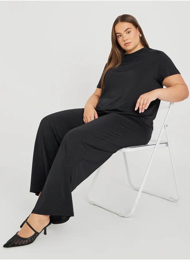 Styli Styli Plus Size Solid Asymmetric Hem T-Shirt and Wide Leg Trousers Co-Ords