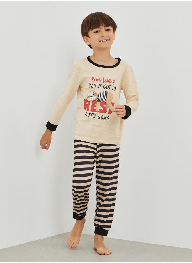 Styli Styli Graphic Print Round Neck T-Shirt and Striped Pyjama Set  - Image 1