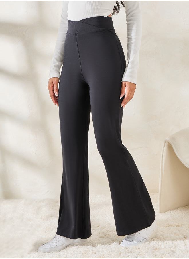 Styli Solid Criss-Cross Waistband Fit & Flare Leggings  - Image 1
