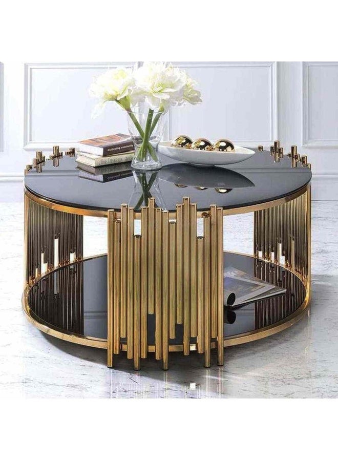 Modern circular table with golden steel frame and dark glass top