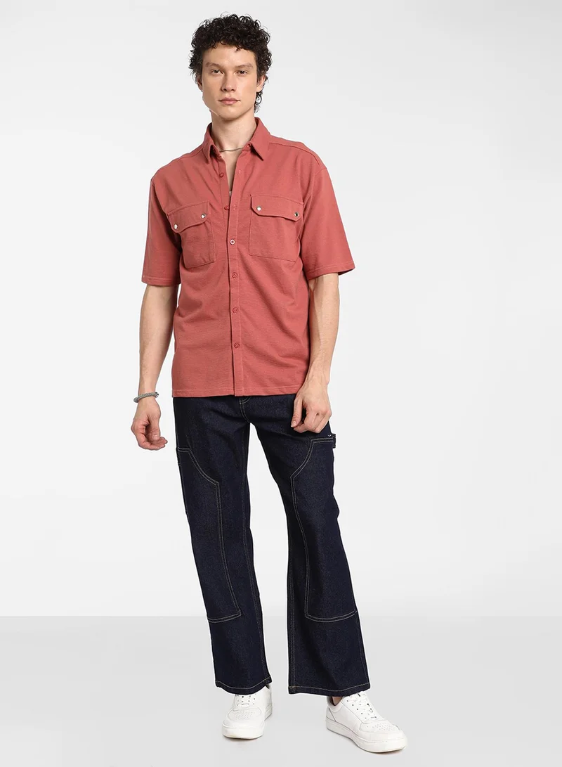 Campus Sutra Men's Terracotta Orange Utility Knit Shirt For Casual Wear | Spread Collar | Short Sleeve | Button Closure | Shirt Crafted With Comfort Fit For Everyday Wear