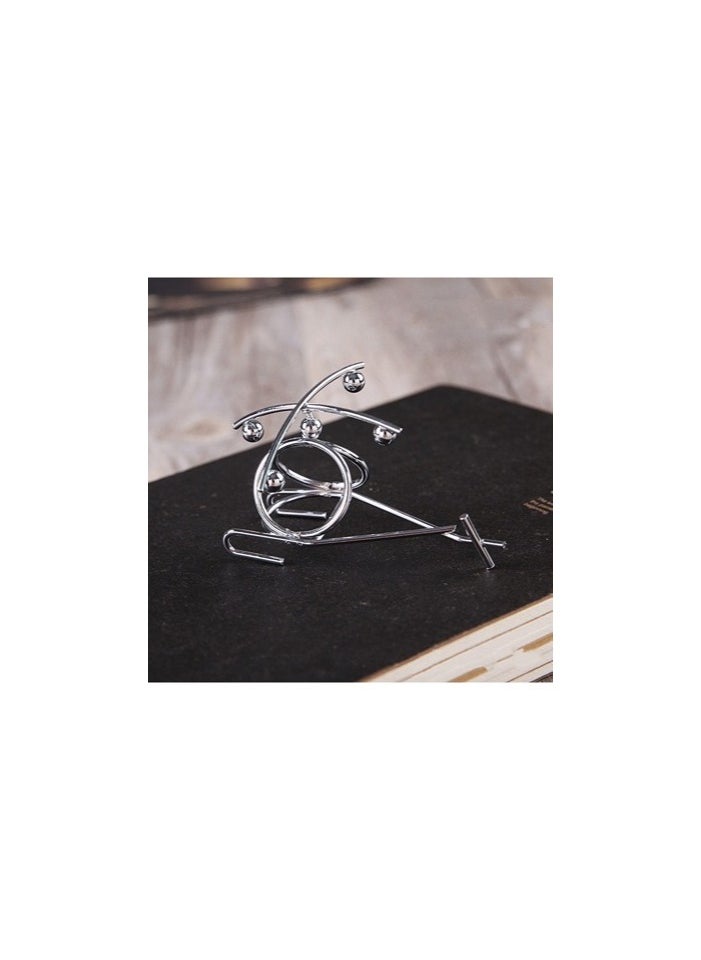 Generic - "Enjoy an experience of balance and calm with the Newton's Cradle - elegant design, smooth movement, and a clever decorative touch that adds a sophisticated scientific touch to your office or home. " - Image 1