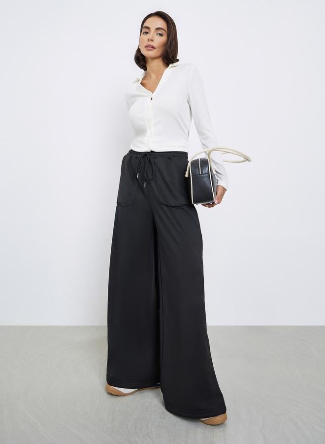 Styli Women Black Plain Wide Leg Joggers with Drawstring Waist - Image 1
