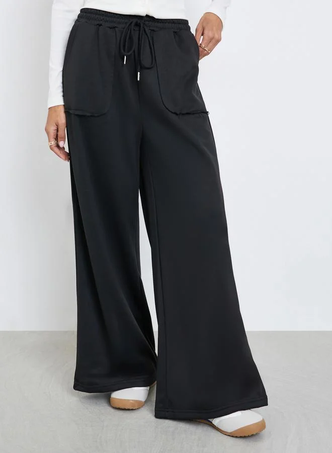 Styli Women Black Plain Wide Leg Joggers with Drawstring Waist