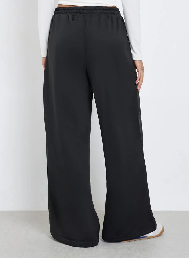 Styli Women Black Plain Wide Leg Joggers with Drawstring Waist