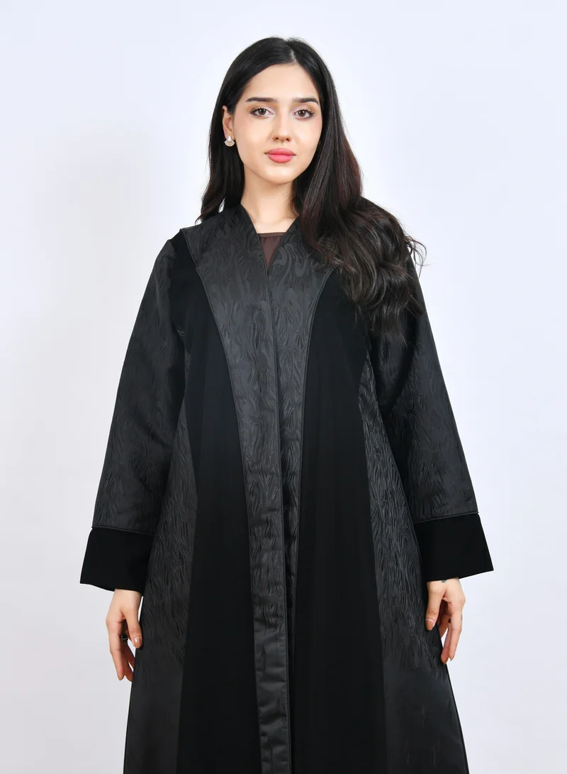HAWRAA ABAYA Elegant black abaya designed with a cloche cut and jacquard fabric overlays for a touch of luxury and sophistication.