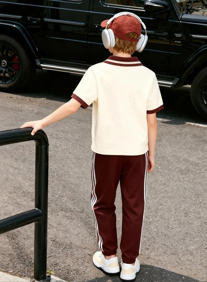 تايك تو مجموعة من بنطال وقميص بولو بنمط كتل الألوان