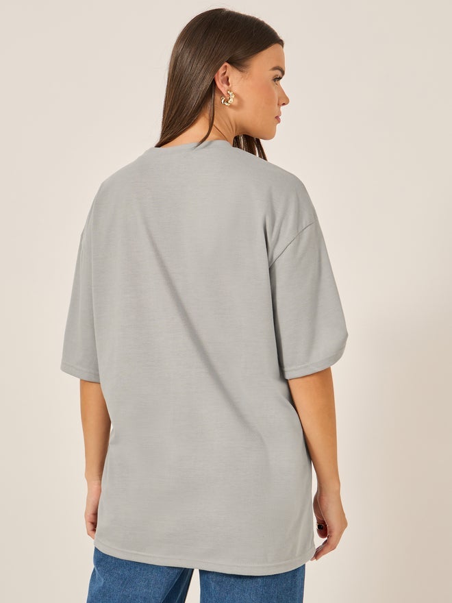 ستايلي تيشيرت فضفاض بأكمام قصيرة وطبعة جرافيك - Image 4
