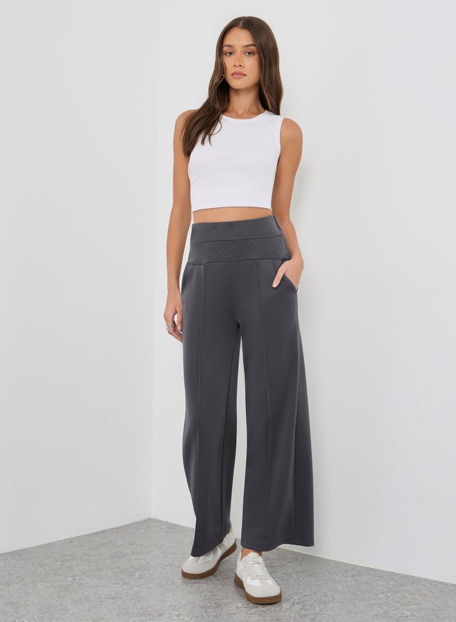 ستايلي بنطلون جوجر ستايلي بخصر عريض وتفاصيل ثنيات - Image 1