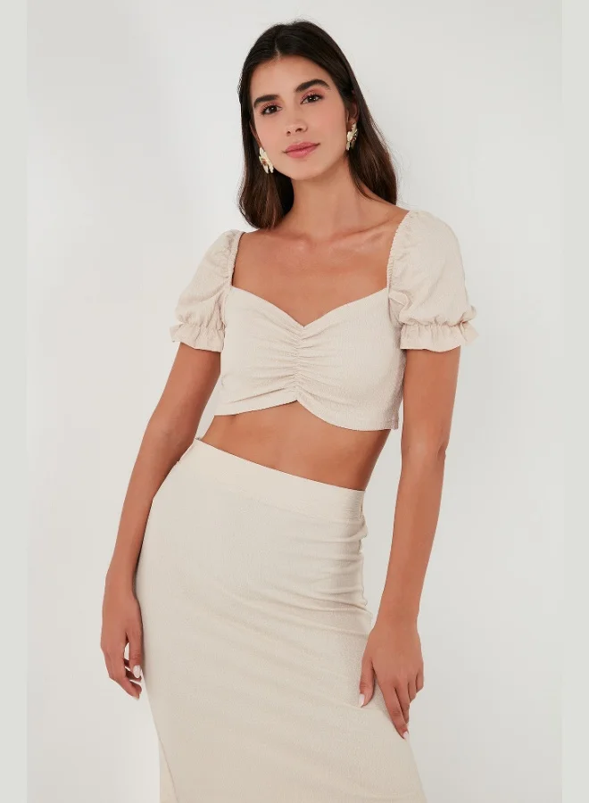 ليلا بلوزة نسائية قصيرة بياقة قلب وخصر مجسم